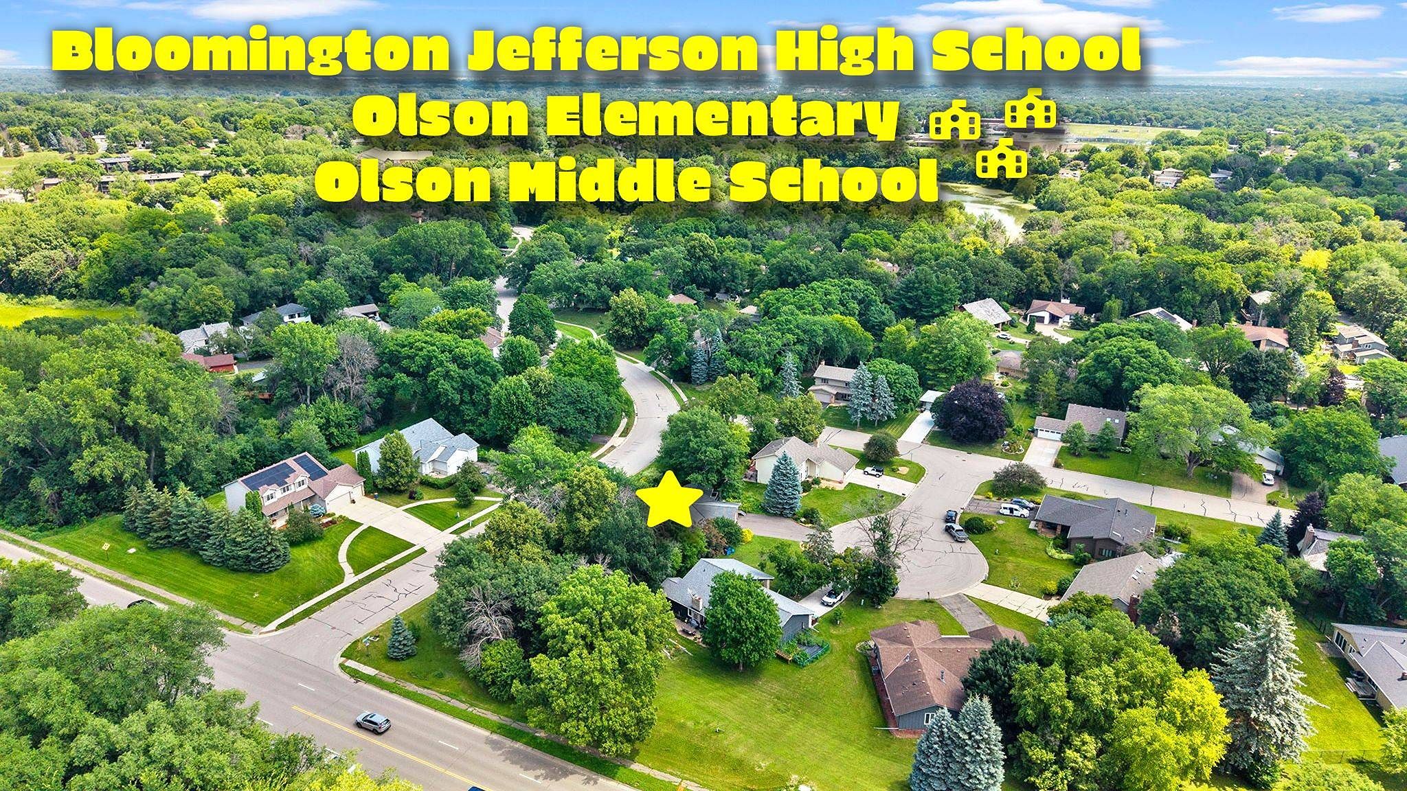 Aerial view of a suburban neighborhood with trees and houses. Text names Bloomington Jefferson High School, Olson Elementary, and Olson Middle School, with yellow icons and a star marking a location.