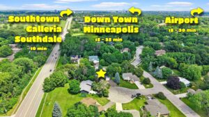 Aerial view of a suburban neighborhood with arrows and text labeling driving times to Southtown Galleria/Southdale, Downtown Minneapolis, and the Airport. A yellow star marks a house in the cul-de-sac.